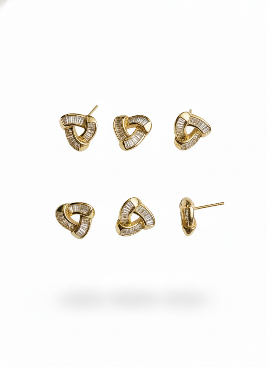 Gold earrings with triangular knot design and embedded baguette-cut diamonds, shown from multiple angles